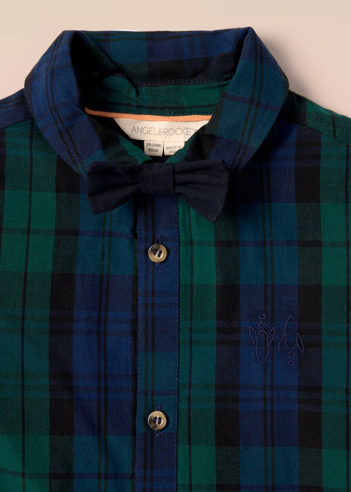 green boys plaid shirt with bow tie